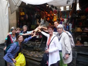 The ladies touching a replica of the lucky boar in Florence