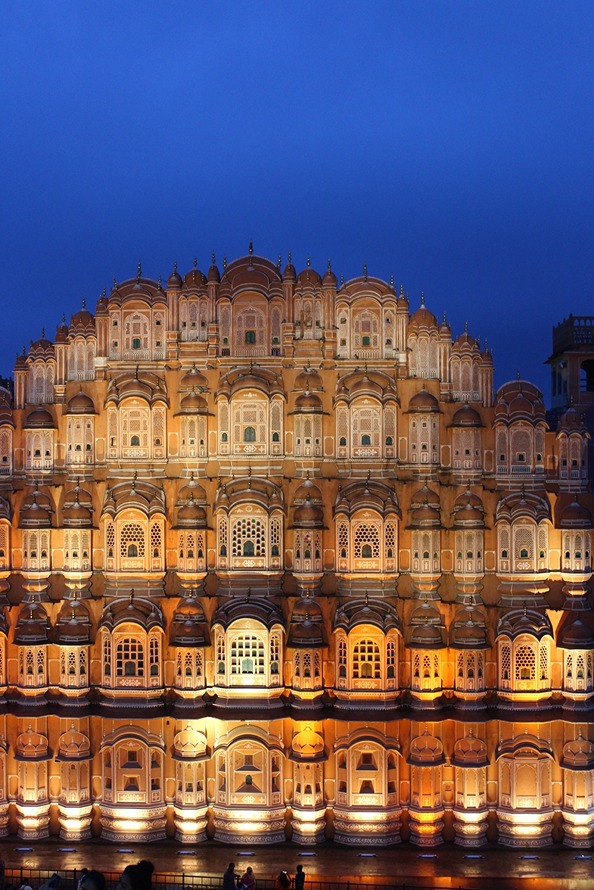 A palace lit up at night in India
