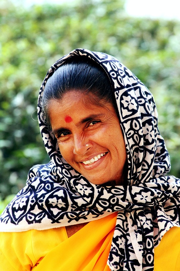A smiling and happy Indian woman with a red bindi during Womens Travel Network's India tour for women