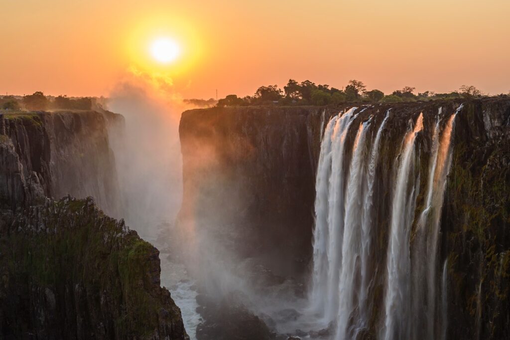Victoria Falls on the Zambezi River in southern Africa at sunset